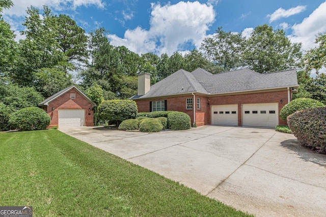 view of front facade with a garage and a front lawn