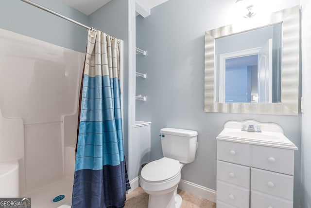 bathroom featuring toilet, vanity, tile patterned floors, and walk in shower