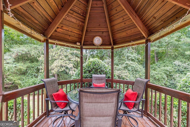 wooden terrace featuring a gazebo