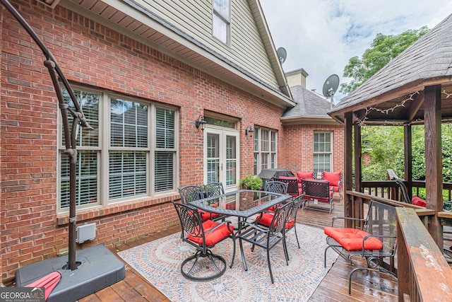 view of patio / terrace with a gazebo, outdoor lounge area, and a deck