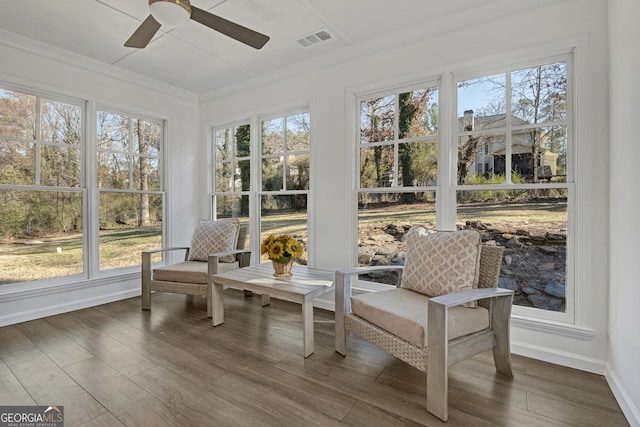 sunroom with ceiling fan and a healthy amount of sunlight