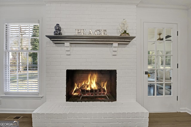 room details with hardwood / wood-style flooring and a brick fireplace