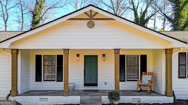 entrance to property with covered porch