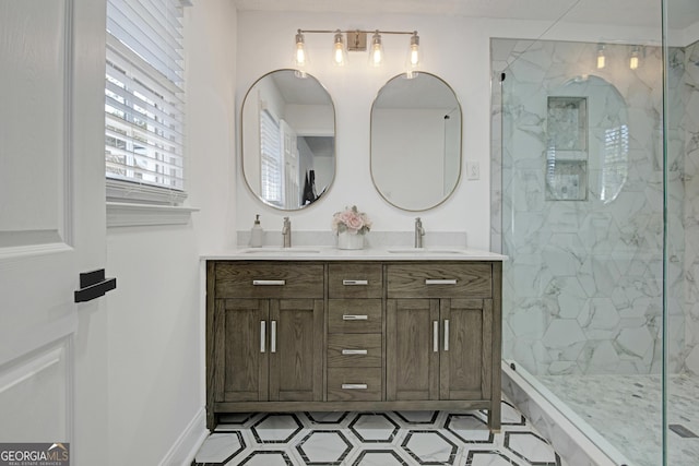 bathroom with tiled shower and vanity