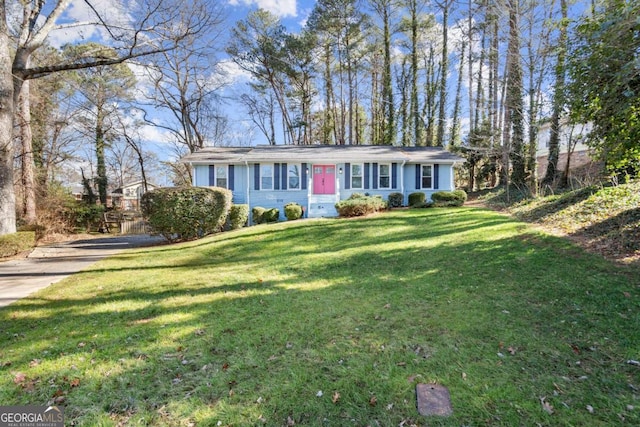 single story home featuring a front lawn