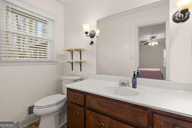 bathroom featuring vanity and toilet