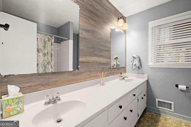 bathroom featuring vanity and a shower with curtain