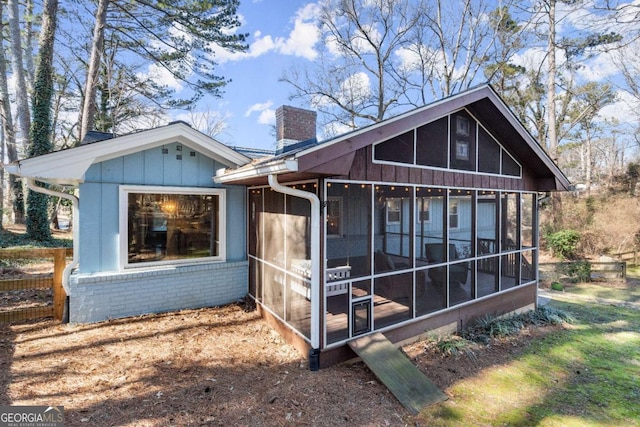 rear view of house with a sunroom