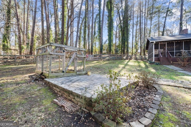 view of yard featuring a sunroom