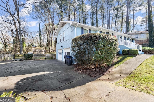 view of side of home featuring a garage