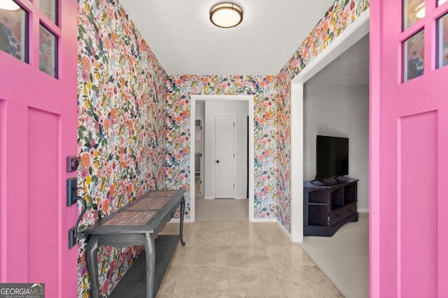 foyer entrance featuring light tile patterned floors