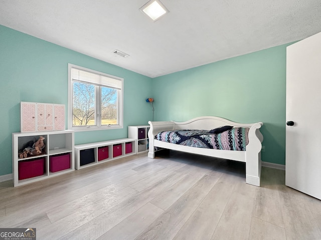 bedroom featuring light wood-type flooring