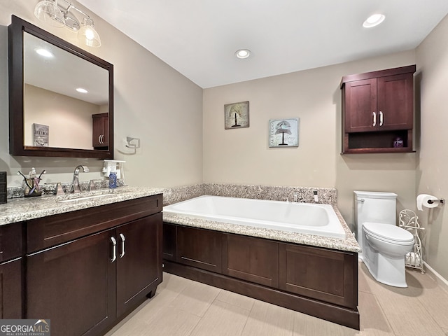 bathroom with vanity, toilet, and a bathtub