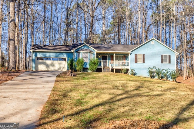 ranch-style home featuring a garage, covered porch, and a front lawn