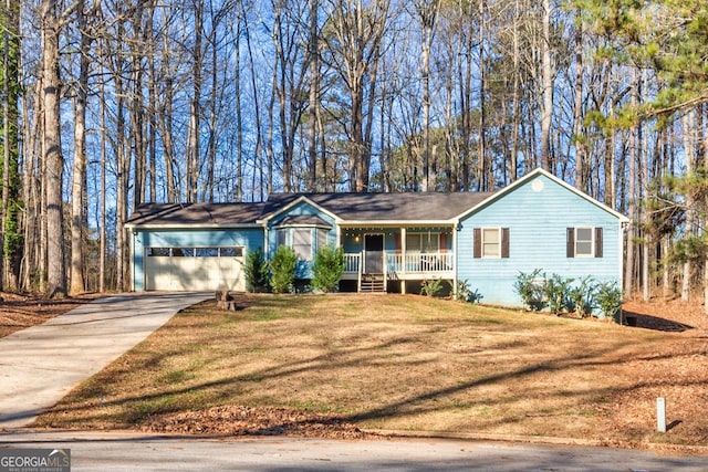 single story home featuring a porch, a garage, and a front yard