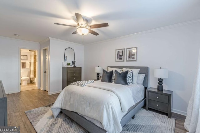 bedroom featuring ceiling fan, ornamental molding, ensuite bathroom, and light hardwood / wood-style flooring