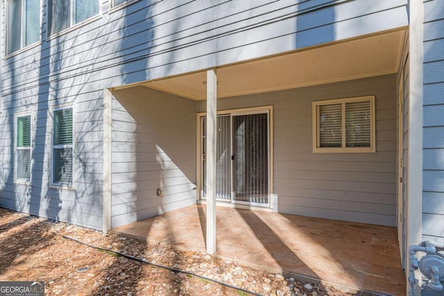 property entrance with a patio