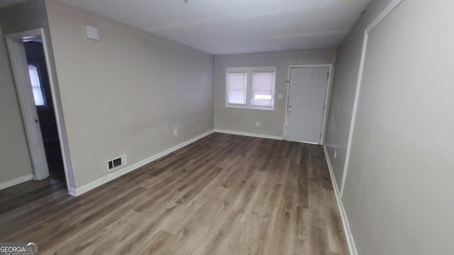 spare room featuring hardwood / wood-style flooring