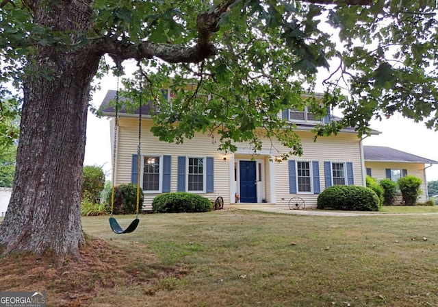 colonial inspired home featuring a front yard