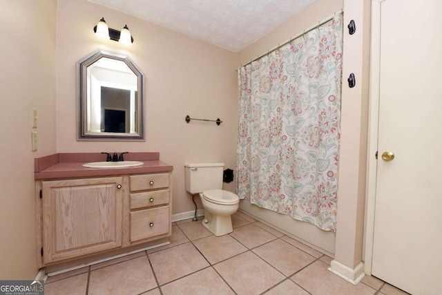 full bathroom with vanity, toilet, tile patterned flooring, and a textured ceiling