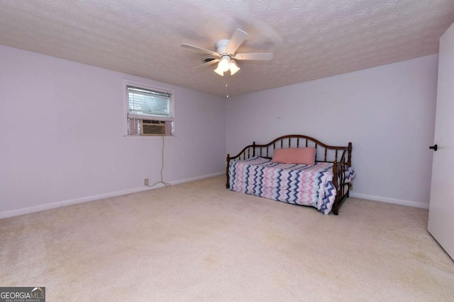 carpeted bedroom with cooling unit, ceiling fan, and a textured ceiling