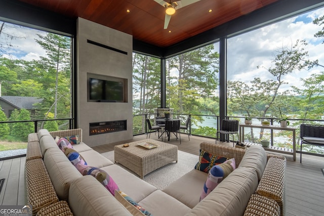 sunroom with plenty of natural light and wooden ceiling