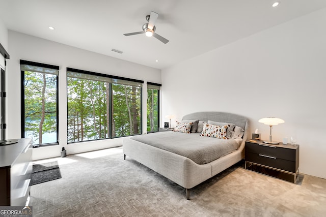 carpeted bedroom featuring ceiling fan