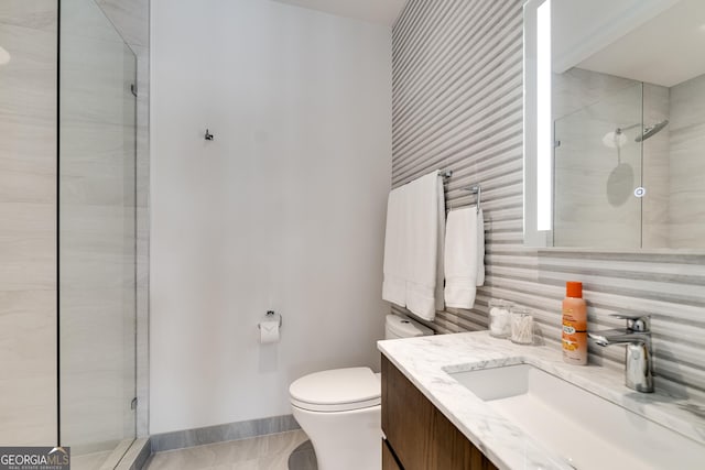 bathroom with vanity, an enclosed shower, backsplash, and toilet