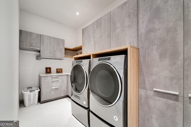 laundry area with washing machine and clothes dryer