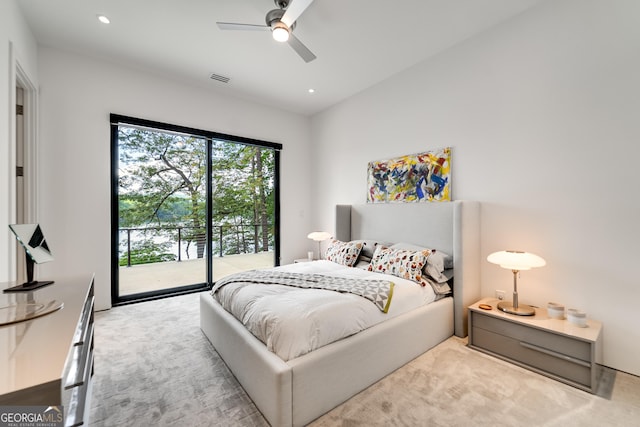 bedroom with vaulted ceiling, access to outside, light colored carpet, and ceiling fan