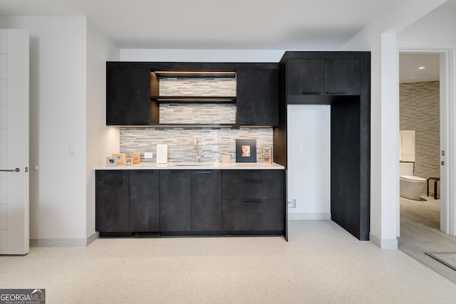 kitchen featuring sink and decorative backsplash