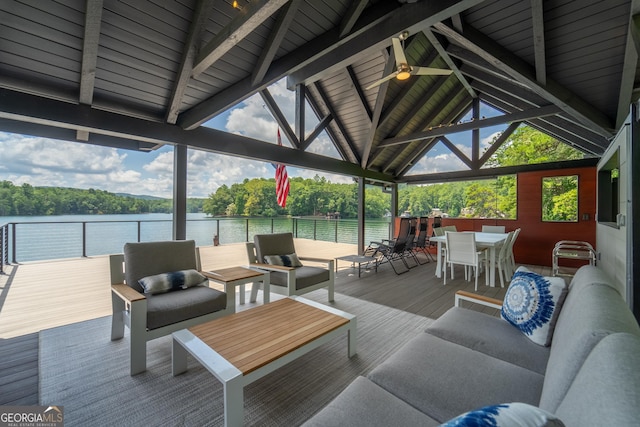 exterior space featuring a water view, ceiling fan, an outdoor living space, and a gazebo