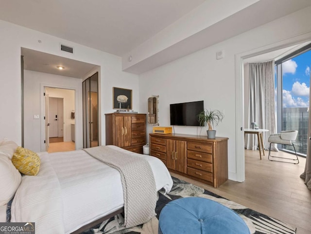 bedroom with light hardwood / wood-style flooring