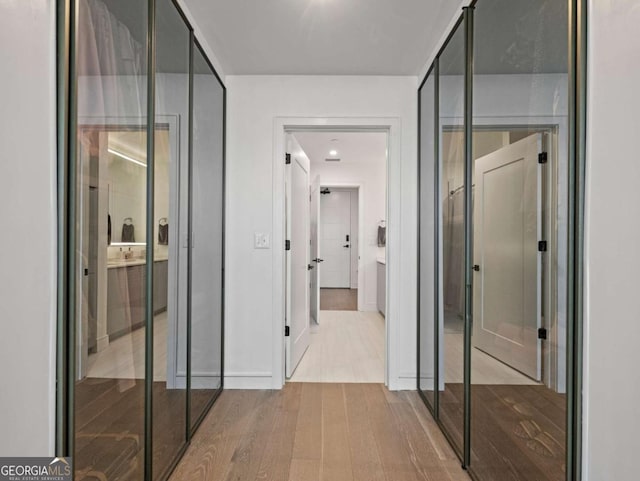 hallway featuring light wood-type flooring