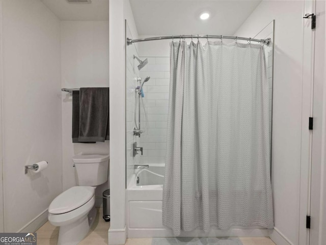 bathroom with shower / bathtub combination with curtain and toilet