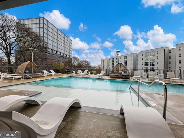 view of swimming pool with a patio