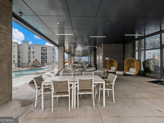 view of patio with a community pool