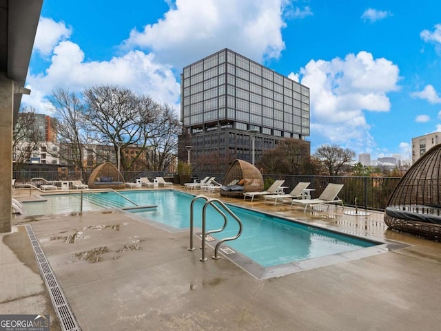 view of swimming pool with a patio