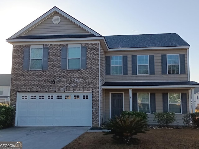 view of front of property featuring a garage