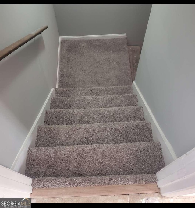 staircase with carpet flooring