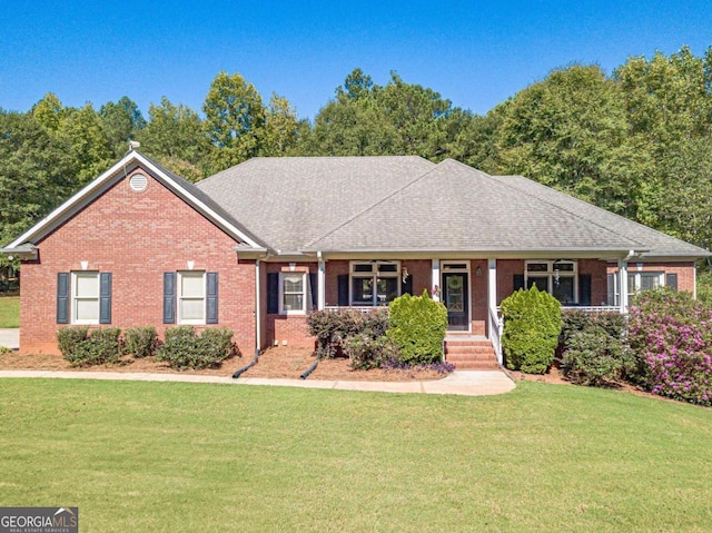 single story home with a porch and a front lawn