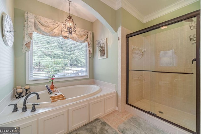 bathroom with a notable chandelier, crown molding, tile patterned floors, and separate shower and tub