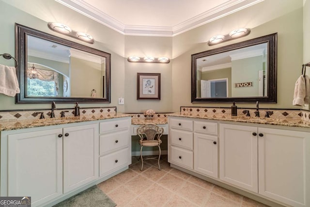 bathroom with crown molding, vanity, and tile patterned flooring