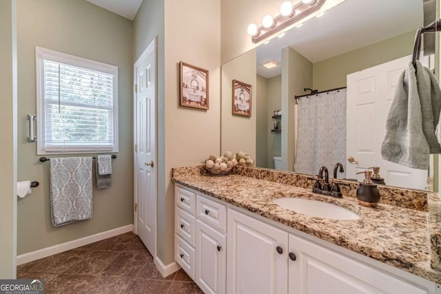 bathroom with a shower with curtain and vanity