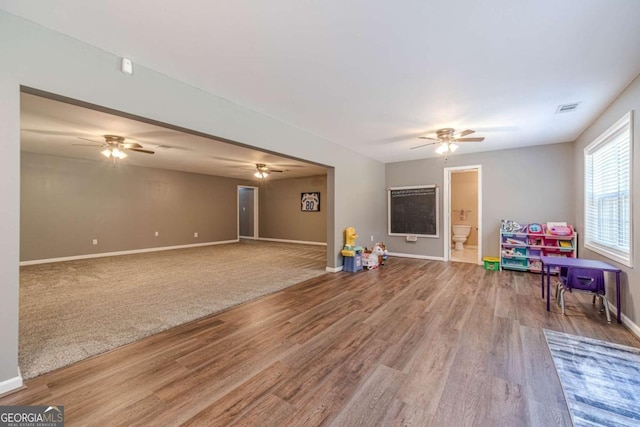 playroom with hardwood / wood-style flooring and ceiling fan