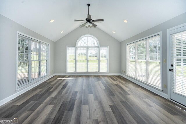 interior space with vaulted ceiling, dark hardwood / wood-style floors, and ceiling fan