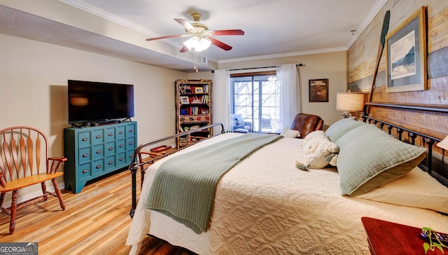 bedroom featuring crown molding, hardwood / wood-style floors, and ceiling fan