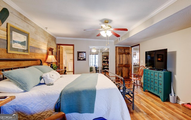 bedroom with crown molding, light hardwood / wood-style flooring, and ceiling fan