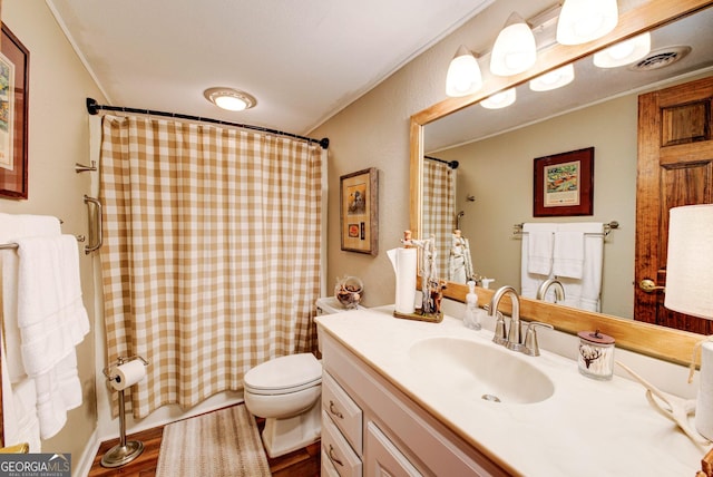 bathroom featuring vanity, curtained shower, toilet, and hardwood / wood-style flooring