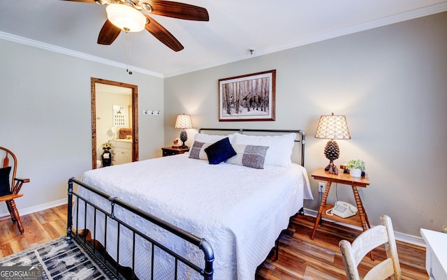 bedroom with connected bathroom, crown molding, wood-type flooring, and ceiling fan